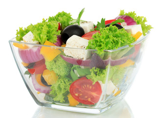 Greek salad on plate isolated on white