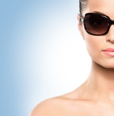 Portrait of a young and attractive woman in sunglasses