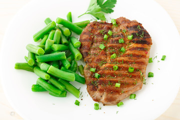 Beef steak with green beans