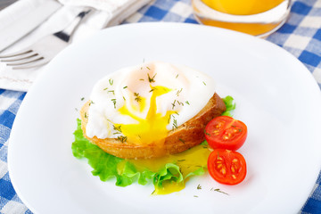 Poached egg with dill on bread