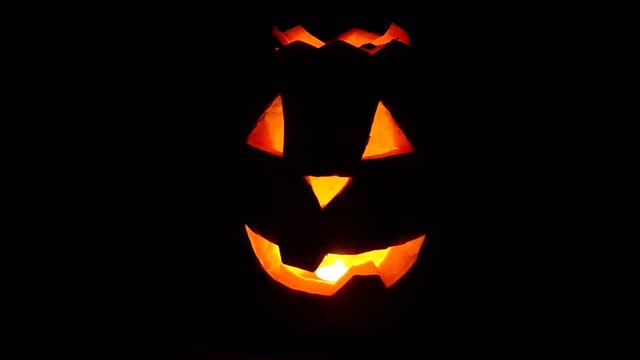 Halloween pumpkin is spinning in the dark
