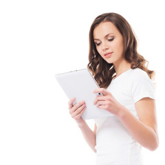 A young and happy girl holding a tablet compute