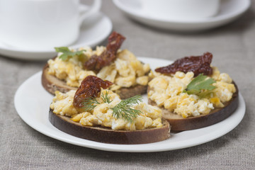 Scrambled eggs on toasted rustic bread