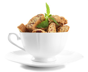 Tasty cookies in cup isolated on white