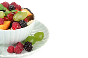 Fruit salad in bowl, isolated on white