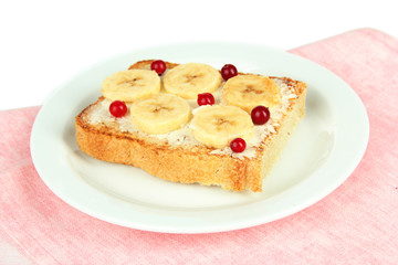 Delicious toast with bananas on plate close-up