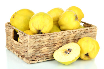 Sweet quinces in wicker basket isolated on white