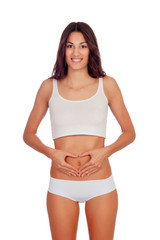 Naklejka premium Girl in white underwear forming a heart with her hands on her be