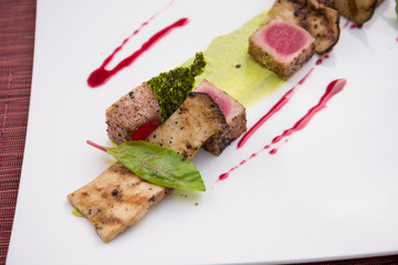 Medium rare lamb roasted decorated dish in Italian style