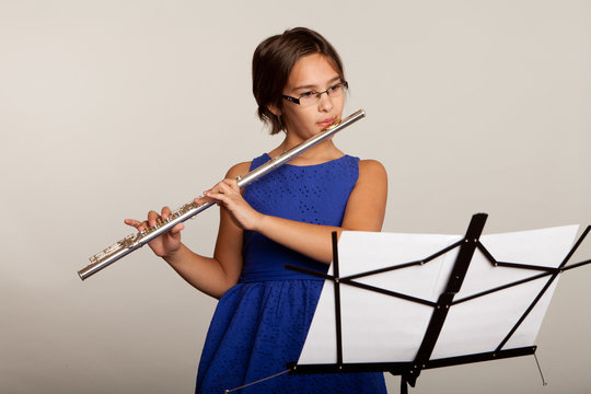 Young Girl Playing a Flute