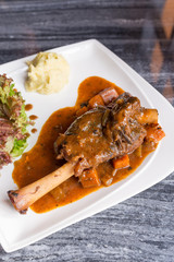 Grilled German pig leg with black pepper sauce
