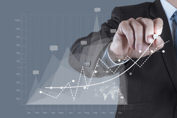 businessman hand draws business success chart