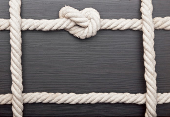 frame made of rope on a wooden background
