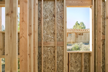View of home construction through window
