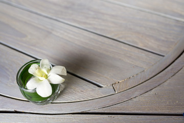 white flower decorate on the brown wooden table