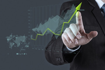 businessman hand draws business success chart