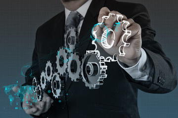 businessman hand show gear to success