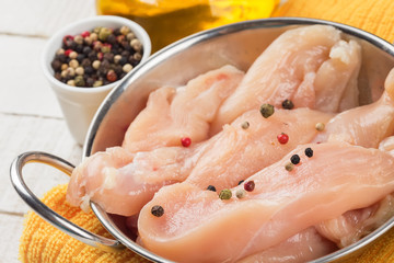 Fresh chicken on wooden table