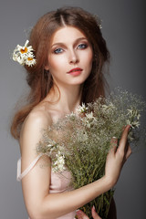 Sentiment. Portrait of Redhair Nostalgic Woman with Herbs