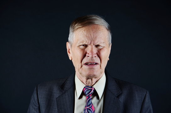 portrait of a businessman with emotions of digust