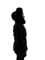 woman winter coat looking up serious silhouette