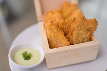 Crisp fish finger nugget in wooden box
