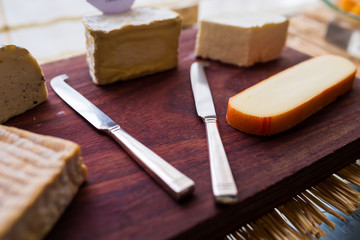 Butter knife with variety of cheese