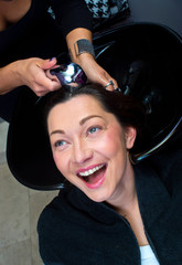Fototapeta na wymiar mature woman washing hair