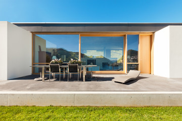 beautiful modern house in cement, view from the garden