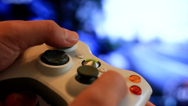 Man playing video game with a joystick