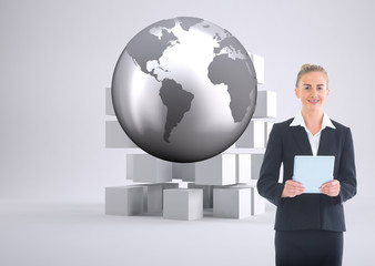 Composite image of businesswoman holding new tablet