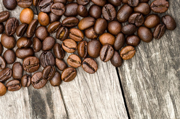 coffee beans close up on old wooden table
