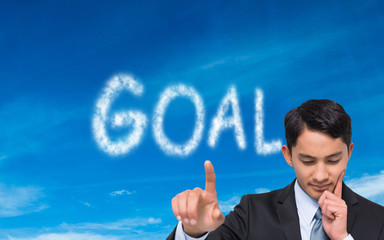 Composite image of thoughtful asian businessman pointing