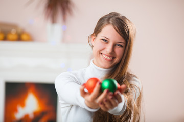 Young woman with christmas ball