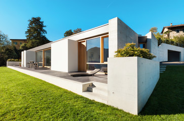 beautiful modern house in cement, view from the garden