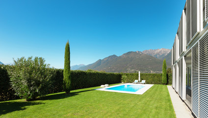 Modern villa with pool, view from the garden