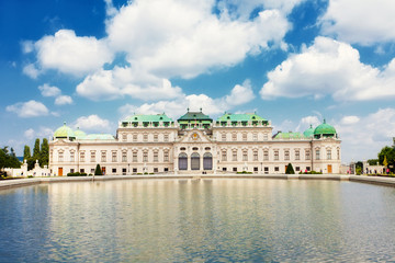 Fototapeta na wymiar Belvedere palace is reflected in fountain water, Vienna, Austria
