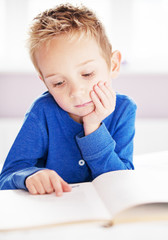 young boy reading