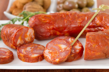 smoked sausages with olives and oil