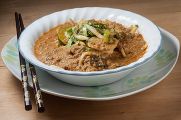Spicy Johor Laksa in a bowl ready to eat