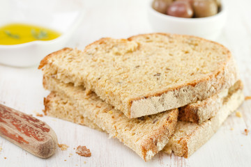 healthy bread with olive oil and olives