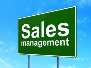 Marketing concept: Sales Management on road sign background