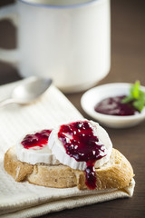 Bread with cheese and blackberry jam