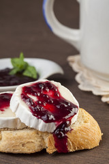 Bread with cheese and blackberry jam