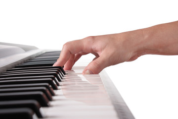 Pianist's hand playing the piano