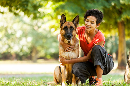 Portrait of woman with german shepherd