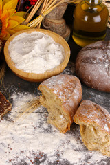 Rye bread on wooden table on wooden background close-up