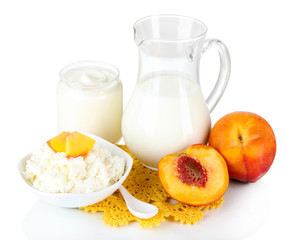 Fresh dairy products with peaches isolated on white