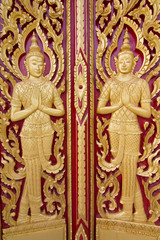 Fototapeta na wymiar Wood carving temple door in Thailand