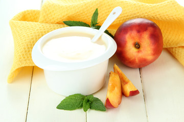 Delicious yogurt with fruit on table close-up